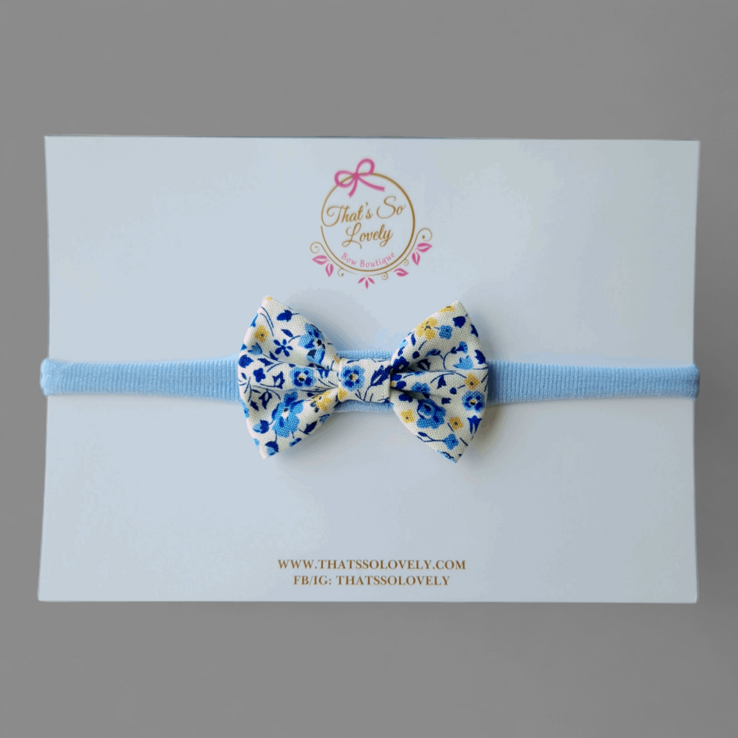 Blaues Haarband aus Baumwolle mit Blumenmuster und Schleife