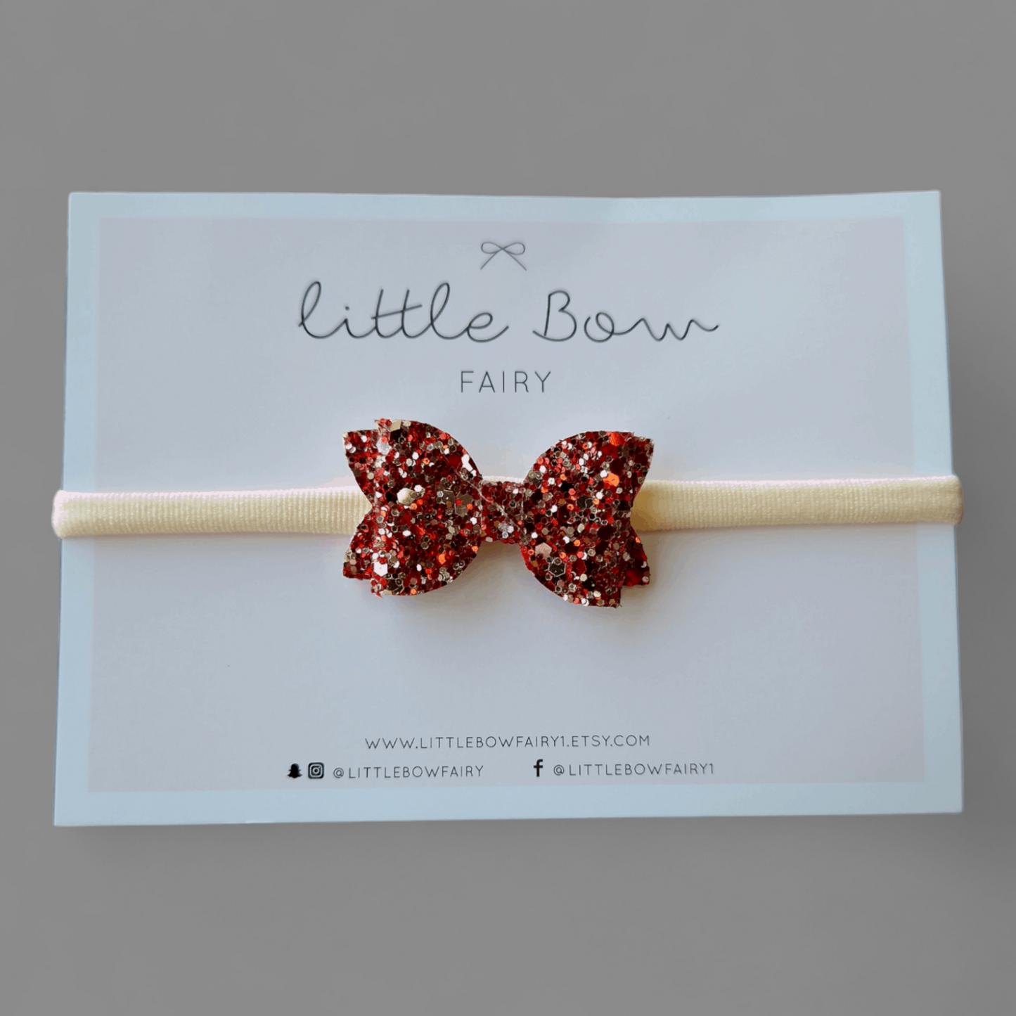 Haarband mit Glitzerschleife in Rot und Silber